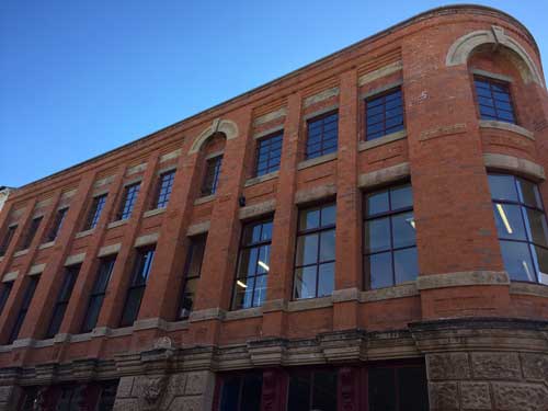 the hive building against a deep blue sky